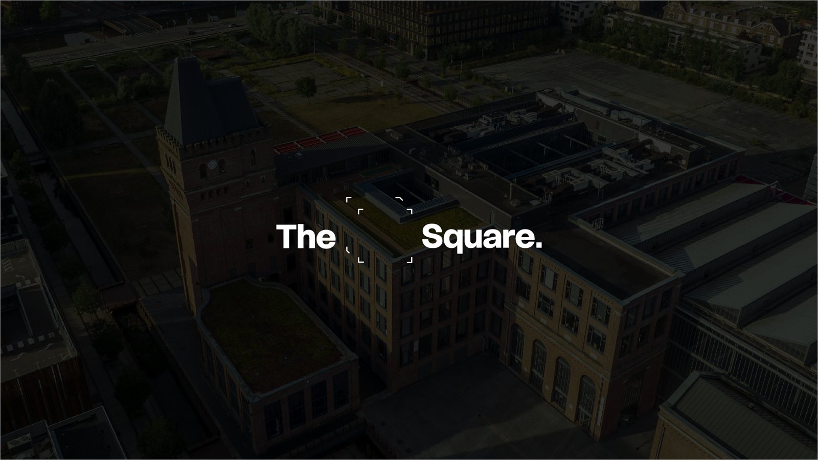 The EuraTechnologies building in Lille at dusk, with the words The Square.